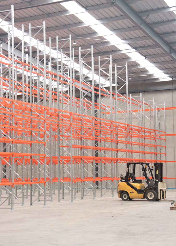 Same new pallet racking rows mid-installation